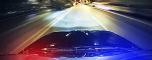 police car lights flashing at night