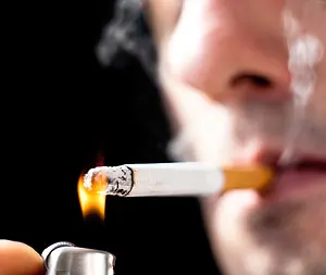 smoker lighting a cigarette