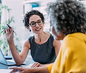 Consultant talks to client in office