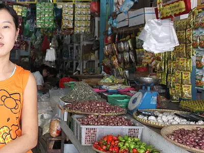 A woman shop owner in Asian market
