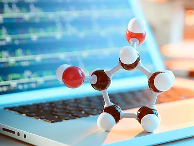 Molecule structure in front of laptop