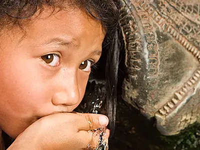 A child in Nepal drinks water