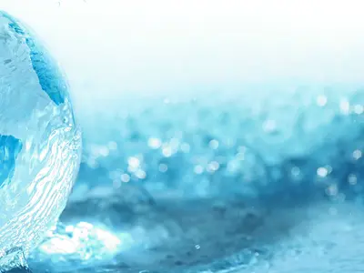 A clear globe surrounded by water droplets