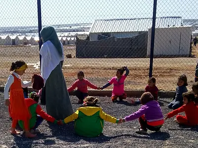 children playing at a refugee camp in Jordan