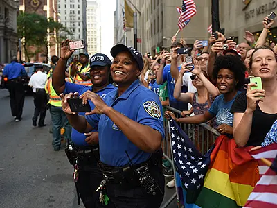 police officers attending a parade and taking pictures