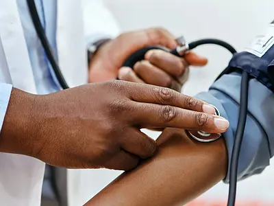 A person has their blood pressure checked