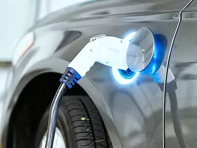 An electric car is plugged into a charger.