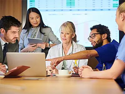 Medical professionals meeting with researchers