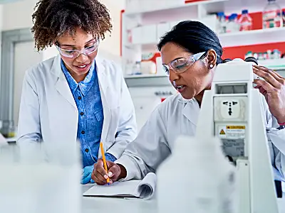 Two women of color working in a lab