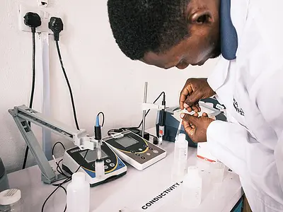 A Nigerian scientist working on water, sanitation, and hygiene