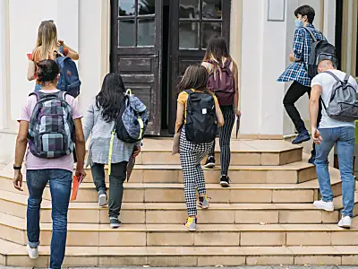 Group of students walking into school