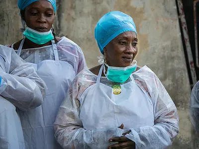 Women health workers receive training in triage practices.
