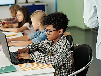 Students filling out information on a computer