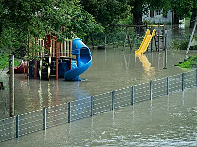 A playground surrounded by floodwaters