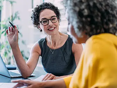 Consultant talks to client in office