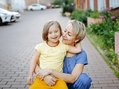 Mother embraces daughter