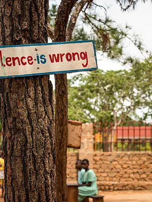 A sign at a Ugandan school participating in the Journeys program promotes nonviolence.