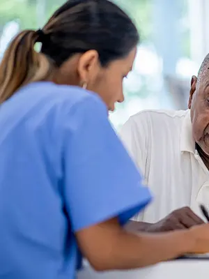 Doctor consults elderly patient