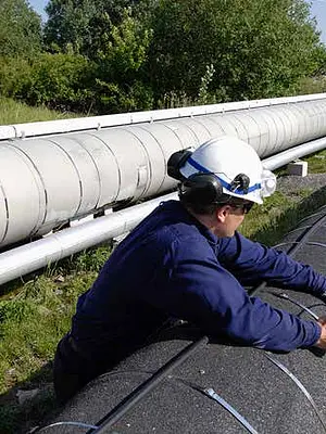 Image of worker in hard hat checking Atlantic Coast Pipeline