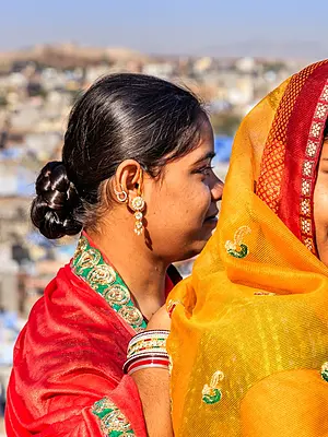 Two women wearing traditional Indian clothes