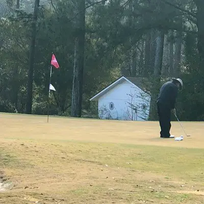 Cancer survivor Michael enjoying a game of golf.