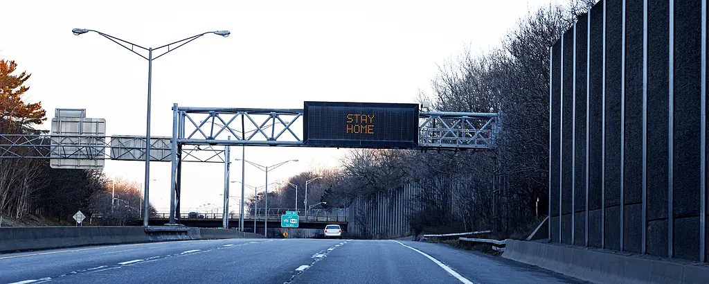 A highway sign reminds people to stay home during the COVID-19 quarantine.