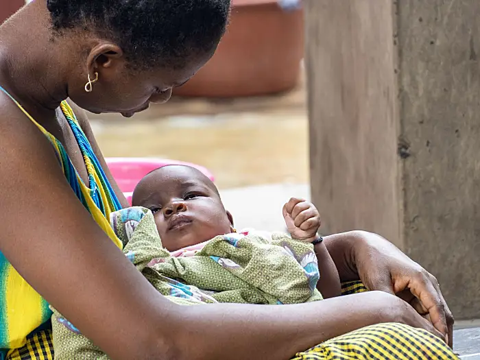 Photo of a mother holding a baby in Senegal