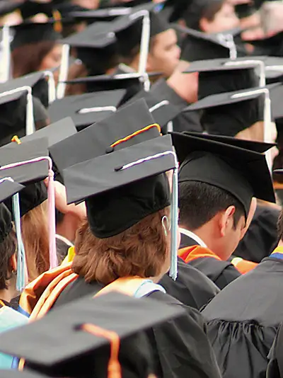 Students in caps and gowns at a graduation ceremony