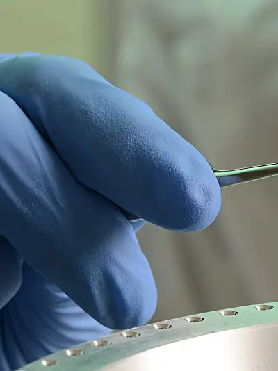 Lab worker using mass spectrometry