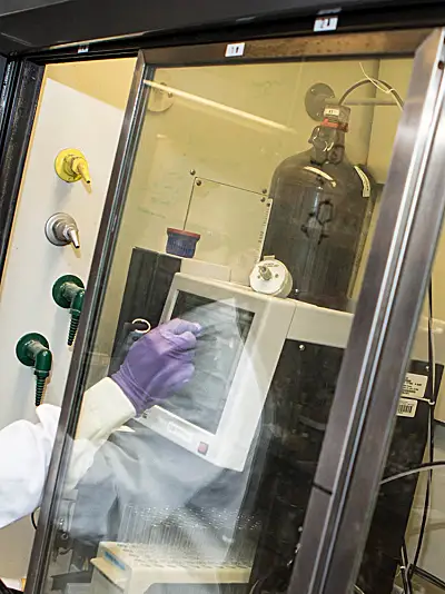 Medicinal chemist working at a chromatograph 