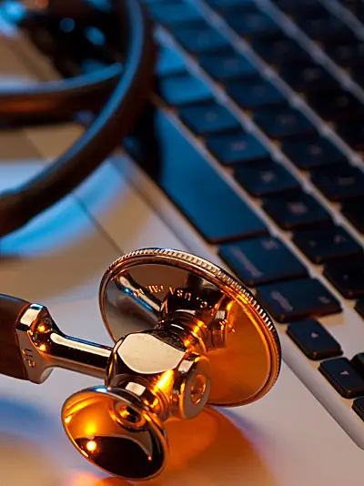 A stethoscope and a computer keyboard