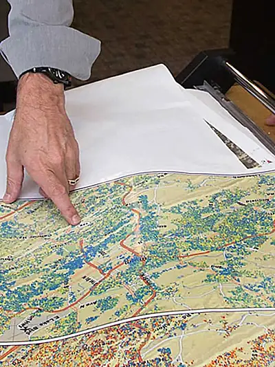 our GIS experts examine large-format maps