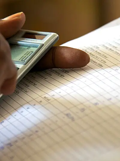 close-up of an evaluator reviewing project documents