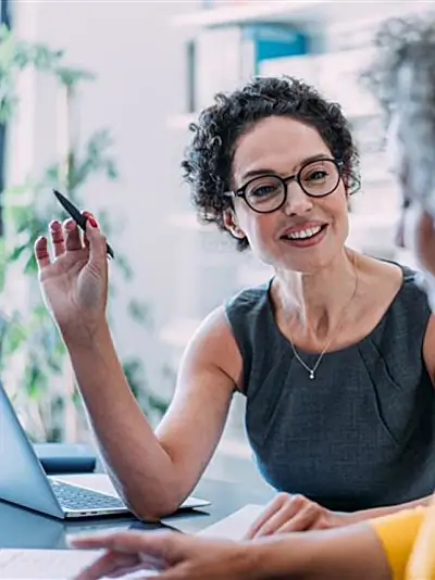 Consultant talks to client in office