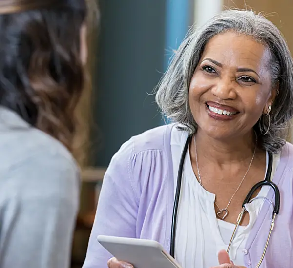 Doctor discussing care plans with her patient