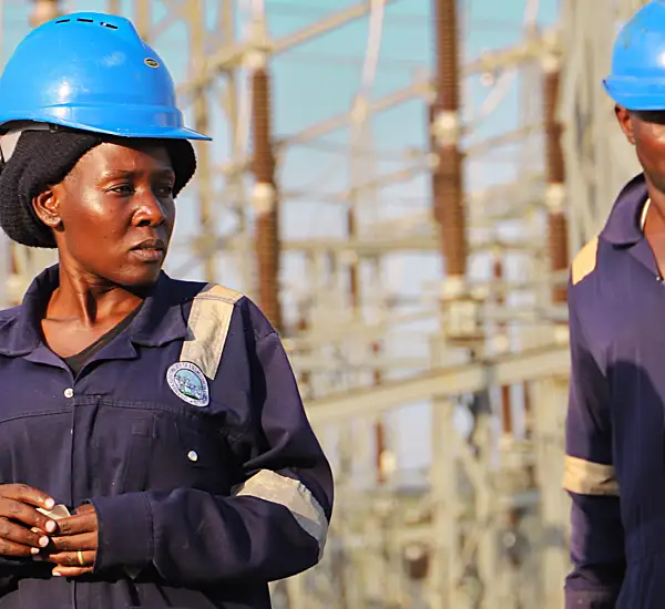 Two workers at a power plant from the Power Africa East Energy Program