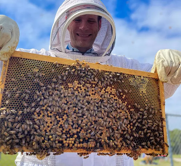 James Harrington in bee suit with the RTI bees