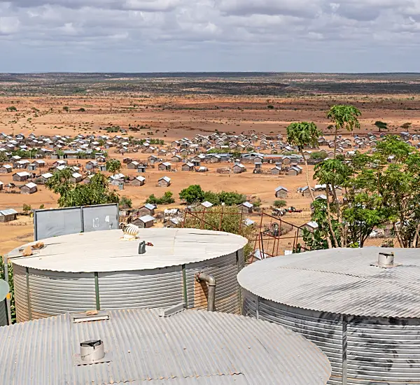 photo of a village in the distance within a dry landscape