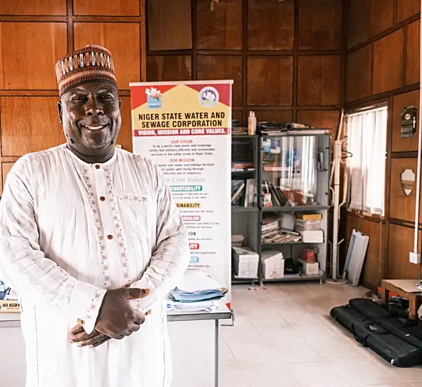 Photo of a Nigerian man smiling in an office