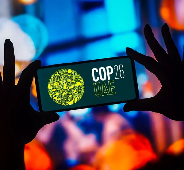 Smart phone with COP28 logo on screen