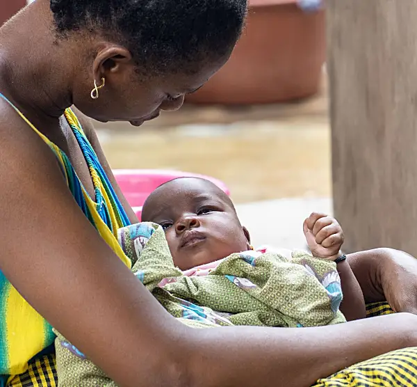 Photo of a mother holding a baby in Senegal