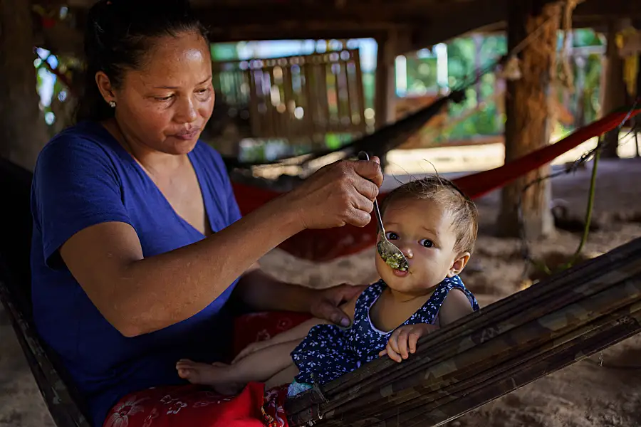 Woman feeding her baby