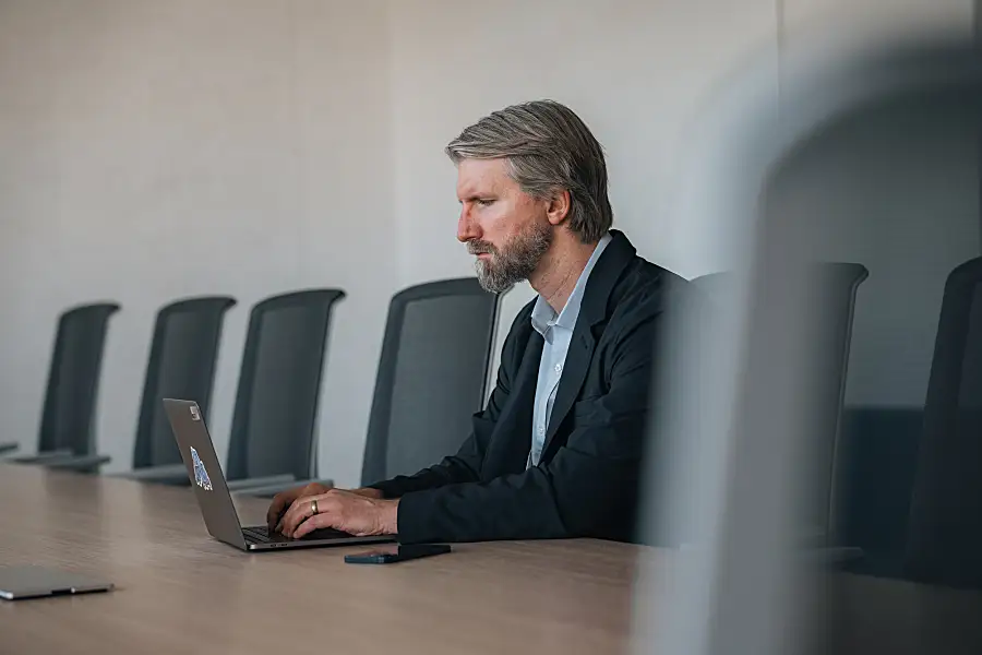 Brad typing on his laptop