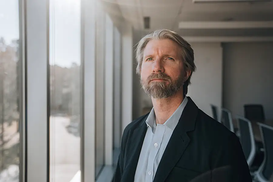 Brad Ray looking out a window