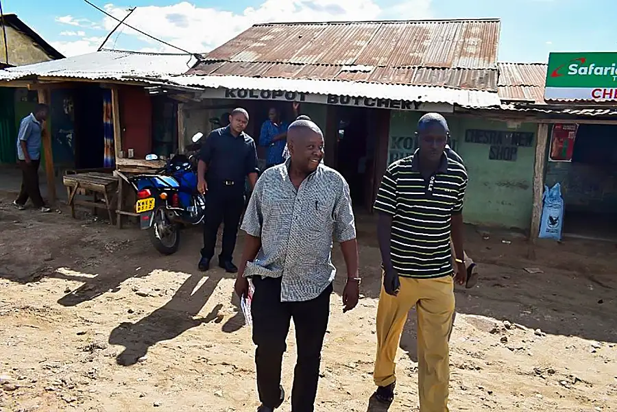 Chepareria Butcheries Self-Help Group founding member and chairman Raymond Lotilem (right) with K-YES staff during a field visit.