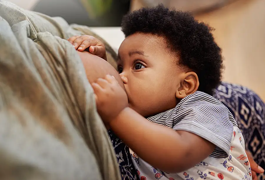 A mother breastfeeds her baby.