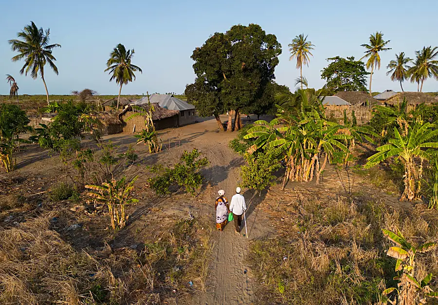 Community drug distributors travel miles to visit families in their homes in remote areas of Tanzania as part of a nationwide effort to eliminate LF