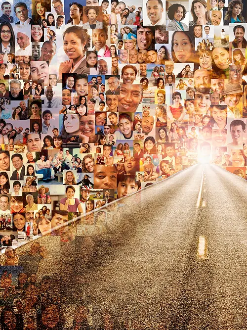 Conceptual image of a long road with individual smiling faces surrounding it