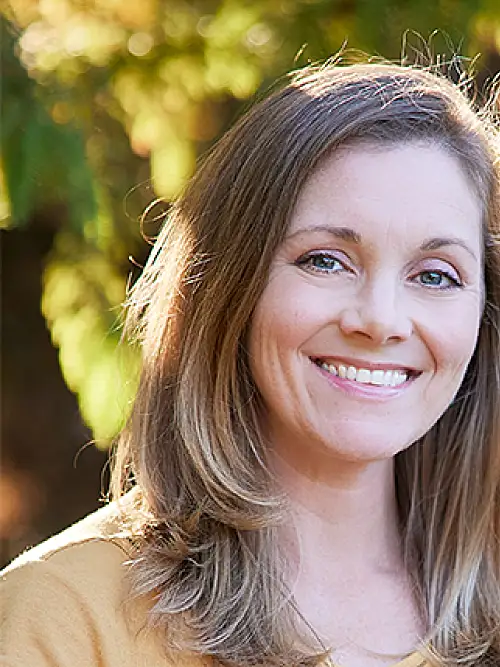 Headshot of Kristen Stolka, showing her smiling outdoors