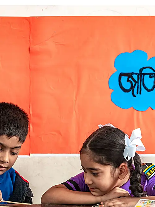 Photo of two children in a classroom in Bangladesh